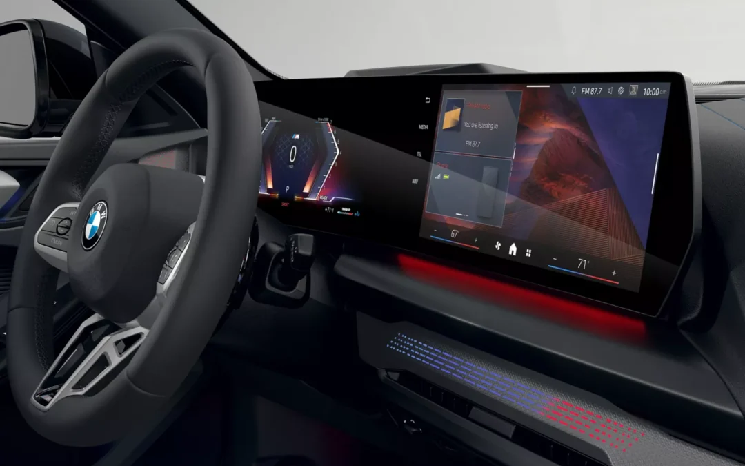 2026 BMW 228 xDrive interior with curved digital display, steering wheel, and ambient lighting